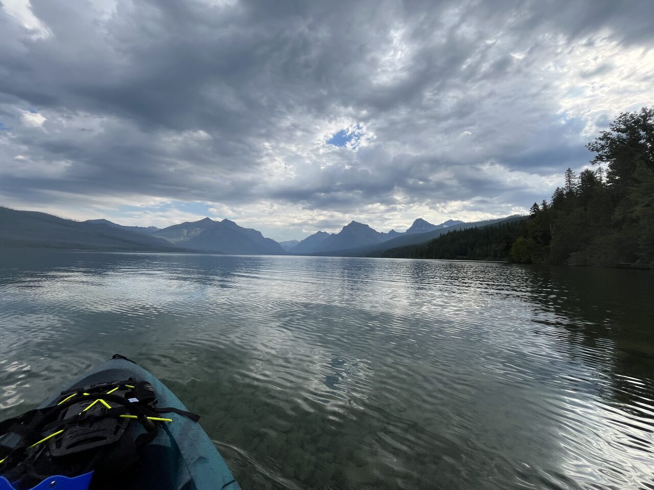 Lake McDonald and McDonald Creek in Glacier National Park, photographed from the water in July 2026