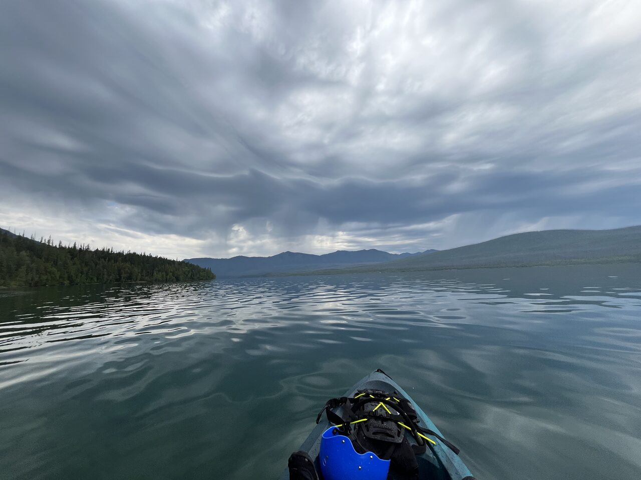 Lake McDonald and McDonald Creek in Glacier National Park, photographed from the water in July 2026