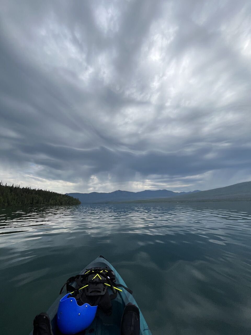 Lake McDonald and McDonald Creek in Glacier National Park, photographed from the water in July 2026