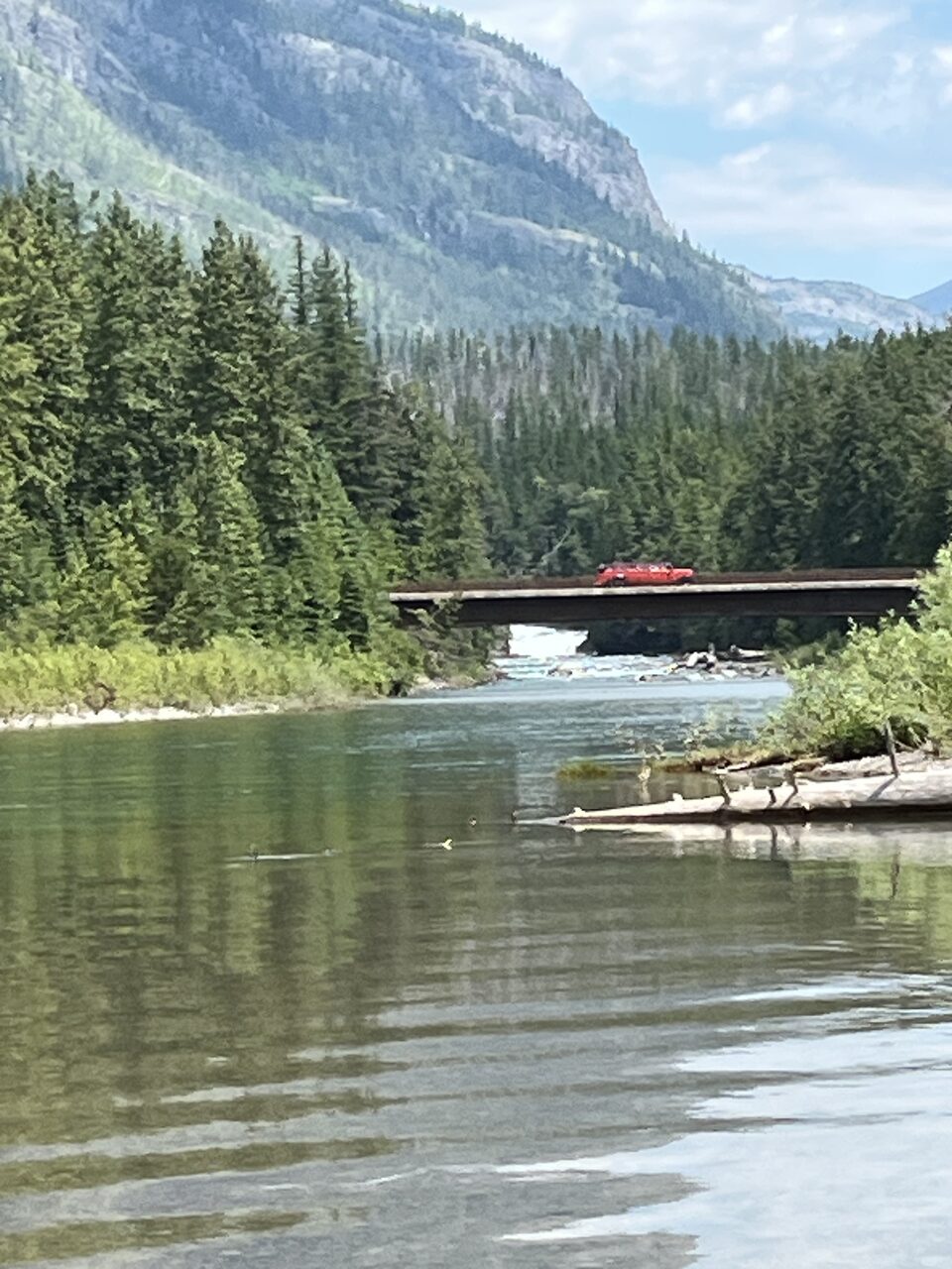 Lake McDonald and McDonald Creek in Glacier National Park, photographed from the water in July 2026