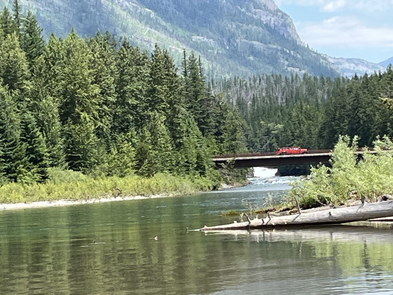 Lake McDonald and McDonald Creek in Glacier National Park, photographed from the water in July 2026