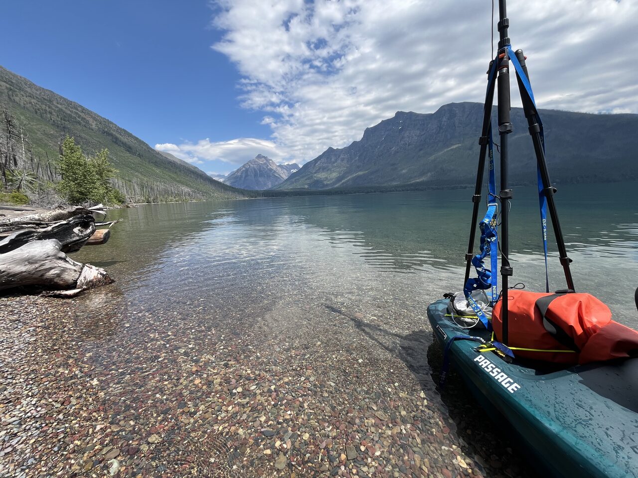 Lake McDonald and McDonald Creek in Glacier National Park, photographed from the water in July 2026