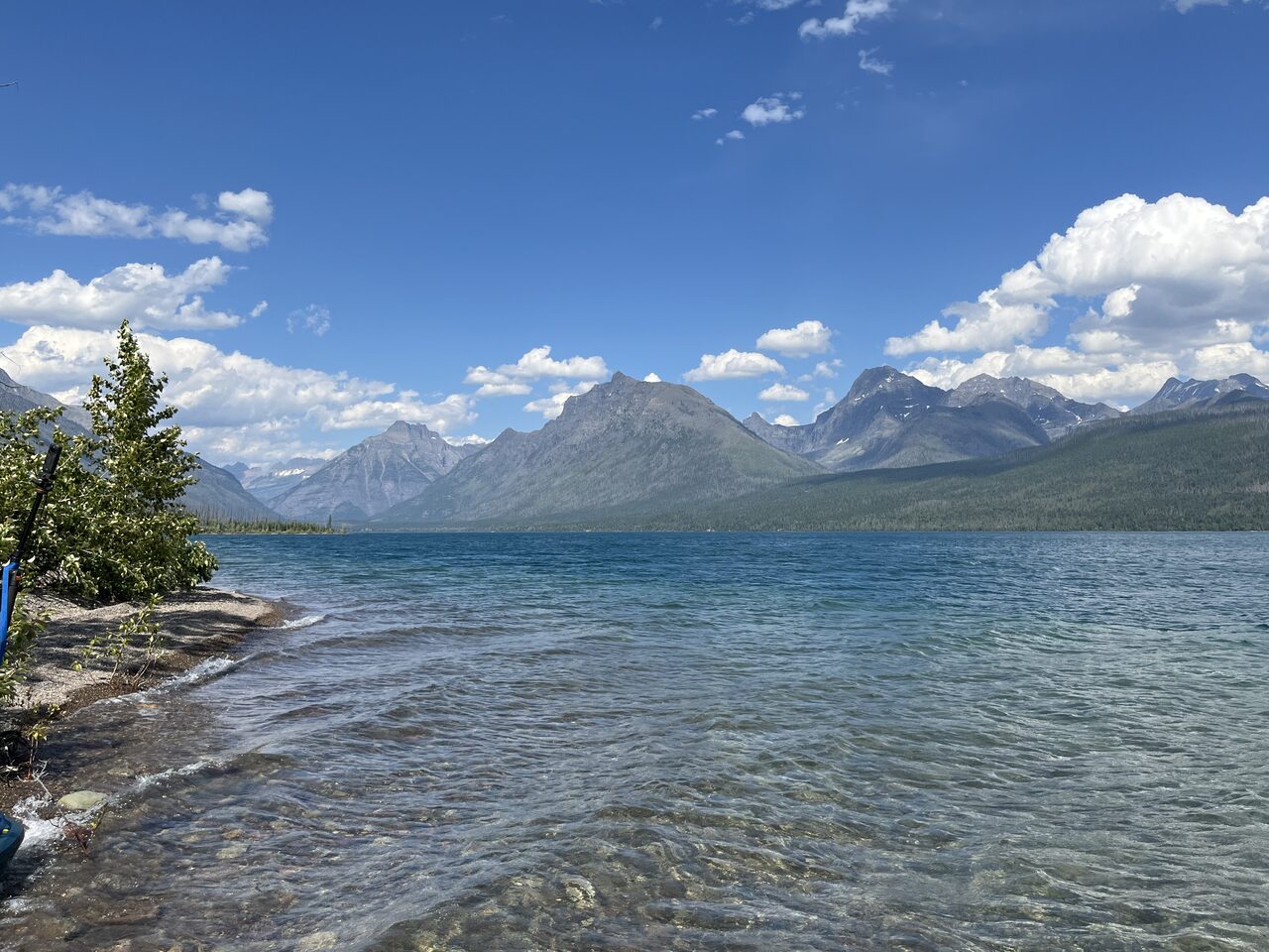 Lake McDonald and McDonald Creek in Glacier National Park, photographed from the water in July 2026