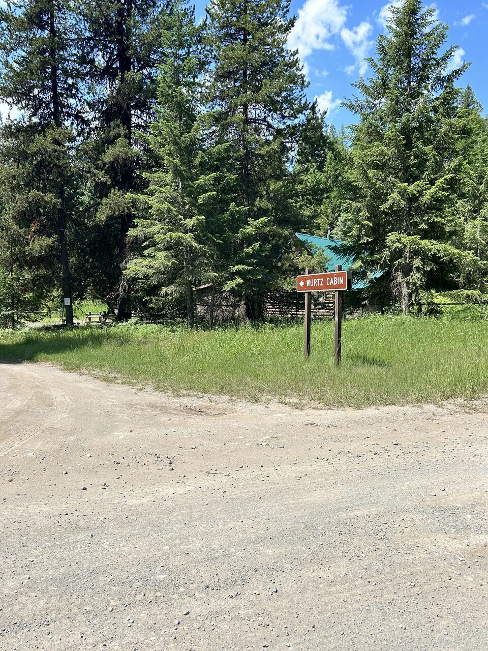 The turn for Schnaus Cabin. This access has no 360 capture yet, so the sign is the landmark to watch for.